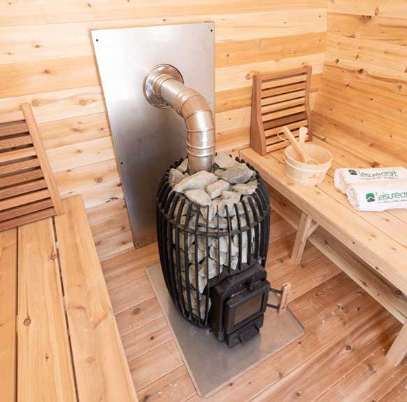 Wood Burning Heater Inside with Chimney Out the Side